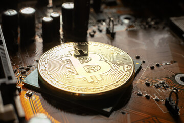 Electronic circuit blur. Bitcoin coin on electronic board