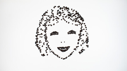 Face of a contented, smiling young woman made of chocolate seeds. Girl closed her eyes in pleasure.