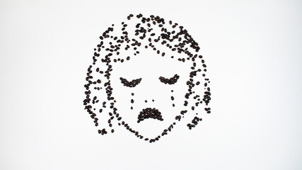 Face of a contented, smiling young woman made of chocolate seeds. Girl closed her eyes in pleasure.