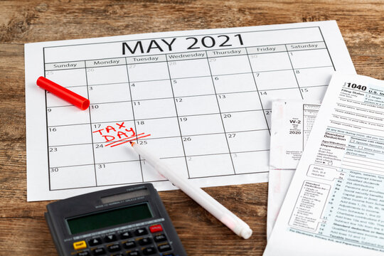 Internal Revenue Service (IRS) has extended the deadline for filing US federal income tax until May 17 2021. Concept image showing a calendar page marking the new tax day for 2021.
