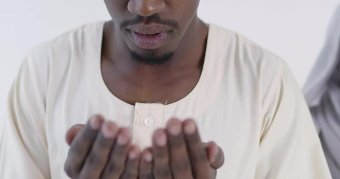 African muslim couple at home in ramadan Making Traditional Fatiha Prayer To Allah God While Wearing A Traditional Sudan fashion clothes in studio