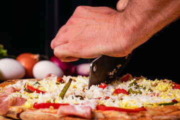 melted mozzarella cheese pizza with dark background