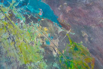 colorful creative motley background: smudged residues of oil paints on a wooden palette, short...