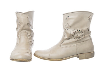 Old worned sandy vintage boots of skin on white background. Isolated.