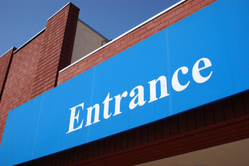 Entrance sign on brick building