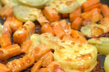 carrot and potato baked with cheese, roasted vegetables with cheese, roasted carrots for meal