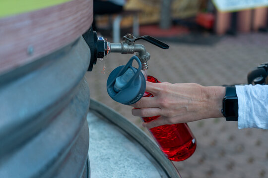 Refilling A Plastic Water Bottle From A Tap