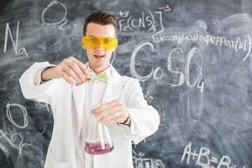Chemist carries chemistry experiment in laboratory. Test-tubes with chemical reagent. Chemical...
