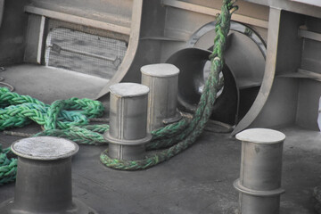 Large ship rope tied to a stake on the ship's deck
