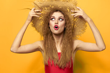 Woman in straw hat bright makeup summer lifestyle fun yellow background