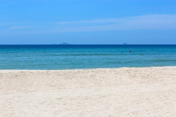 Fototapeta na wymiar deserted beach. Blue sea, blue sky, yellow sand