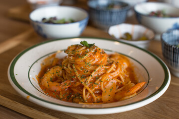 Delicious fresh shrimps and spaghetti with tomatoes.
