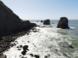 4K Aerial drone photo of rocky coastline and large ocean rocks