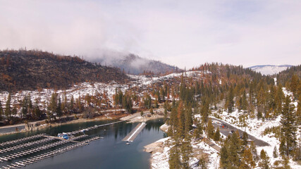 4K Aerial drone photo of foggy winter lake and marina
