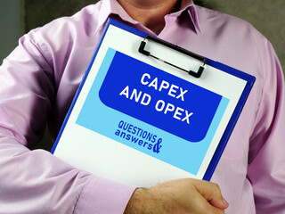 capital expenditure CAPEX AND OPEX operational expenditure text in search bar. Businessman looking...