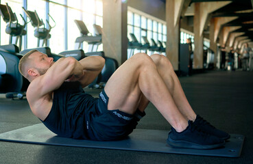 man with weight training in gym equipment sport club