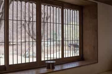 Korean traditional wooden tea table with wooden windows.