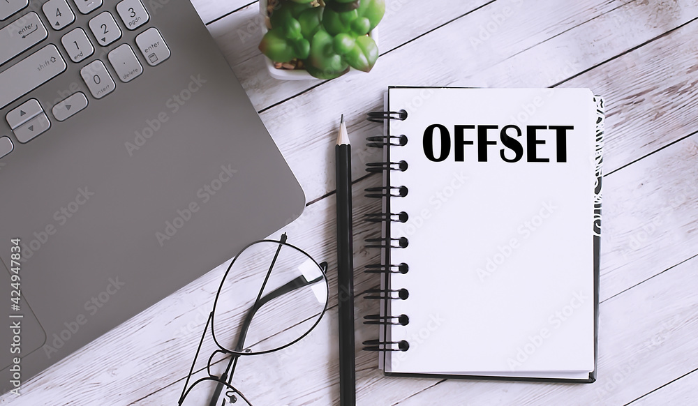 Poster offset text on the notebook with office background