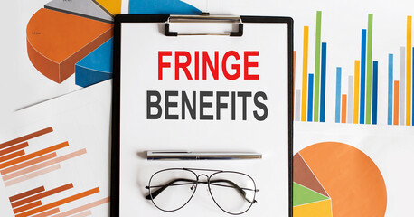 FRINGE BENEFITS text . Conceptual background with chart ,papers, pen and glasses, business