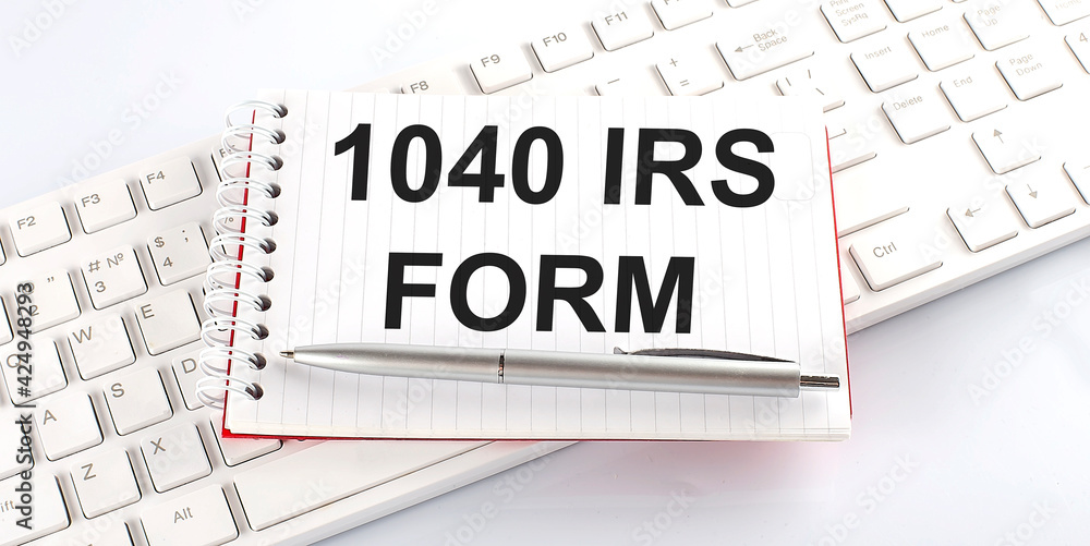 Poster text 1040 irs form on keyboard on the white background