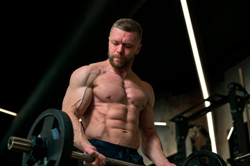 man with weight training in gym equipment sport club