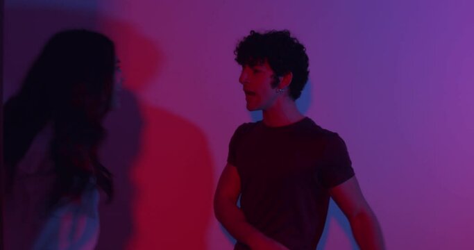 furious quarrel - young couple furiously quarrels pushing each other