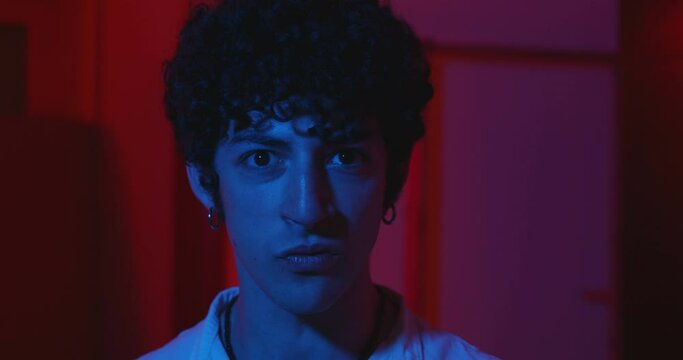 aggressiveness, angry - young man approaches the camera with furious look