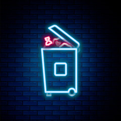 Obraz premium Glowing neon line Trash can icon isolated on brick wall background. Garbage bin sign. Recycle basket icon. Office trash icon. Colorful outline concept. Vector