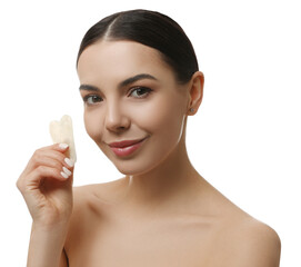 Beautiful young woman doing facial massage with gua sha tool on white background