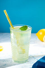 Glass of fresh homemade tasty lemonade with copyspace. Vertical format.