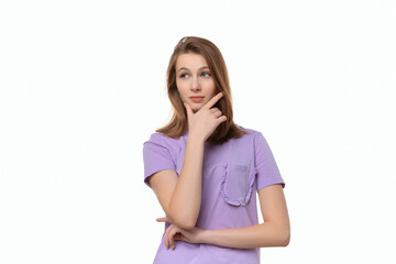 Portrait of cute thinking young woman holding arm on chin wear casual t shirt