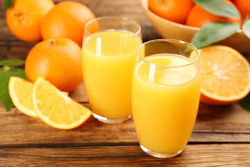 Naklejka na ściany i meble Orange juice and fresh fruits on wooden table