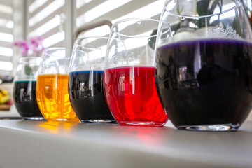 Different colors in glasses for coloring Easter eggs