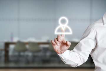 Male hand press employee icon on a virtual display screen. Team building or recruitment