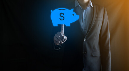 Businessman hold piggy bank icon .Business and Money spending planning, and investment budget, Business saving money concept.save or investment