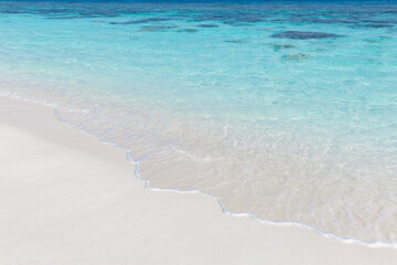 Perfect crystal clear turquoise water and white sandy beach in the Maldives