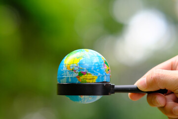 hand holding earth globe