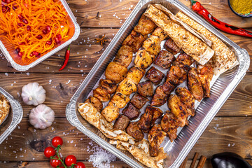 Shish Kebab and lula kebab are placed in a container.