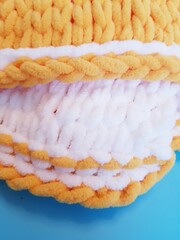 hand-knitted yellow and white plaid, chunky knitting, close-up
