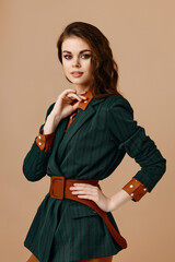 beautiful woman in a fashionable jacket shirt belt hairstyle makeup