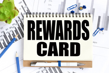 REWARD CARD. Text on white notepad paper on light background