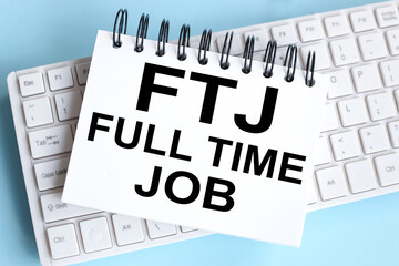 Full-time JOB message. FTJ. time to restart. text on white notepad paper on white keyboard