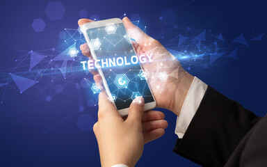 Hand using smartphone with technology concept