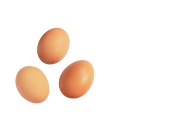 Three organic eggs isolated on white background.
