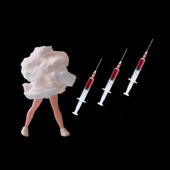 Three syringes filled with red liquid, next to a cloud from which a woman's doll's legs protrude, on a black background