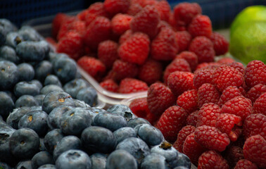 raspberries and blueberries in a bowl