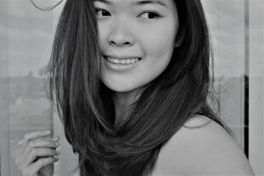 Portrait of a young Asian woman with nature beauty and no make up in black and white