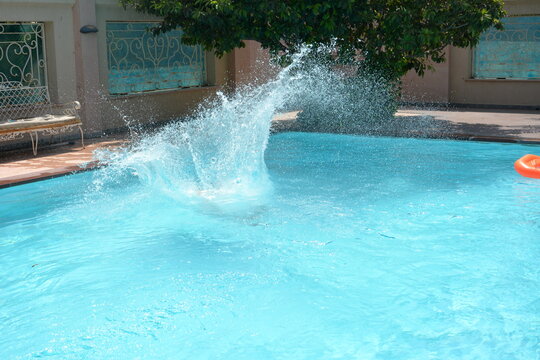 a splash you get when you canonball in your pool © hashabde