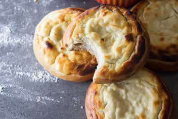Appetizing round scones with quark. Top view photo of homemade sweet buns made of cottage cheese....