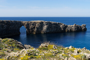 View of Pont d'en Gil, in Menorca (Balearic Islands, Spain), in a sunny day with blue sky